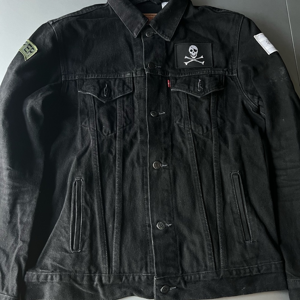 Custom Levi’s black jean jacket with 3 patches sewn on & print on the back